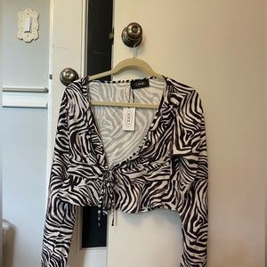 Never worn, animal print top